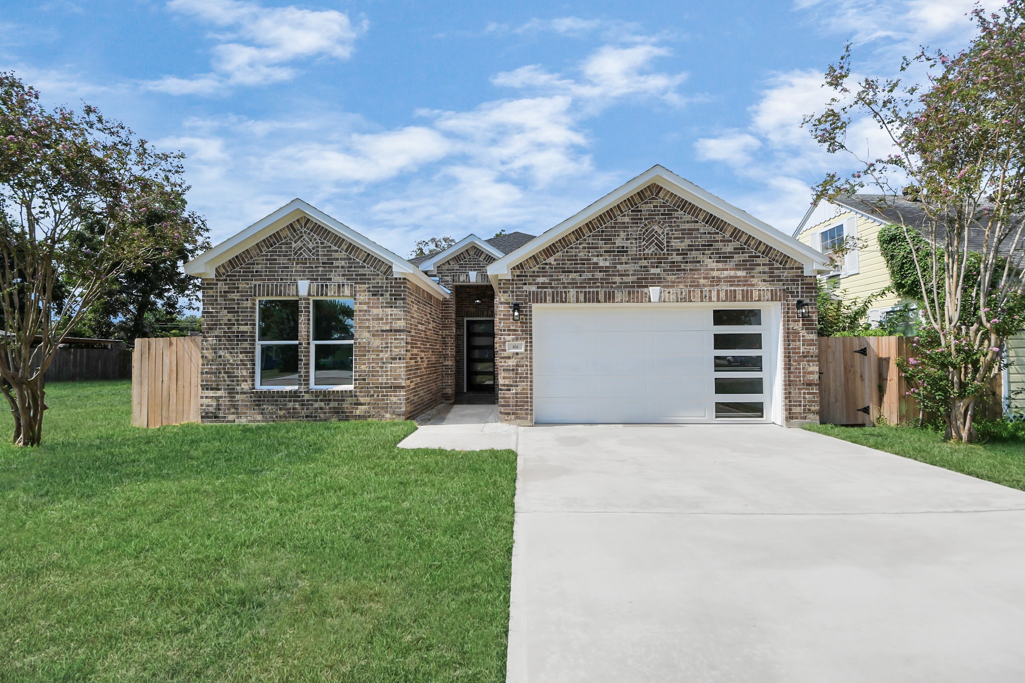 406 South Iowa Street La Porte, TX 77571 - Photo 43 of 49 a front view of a house with a garden and yard