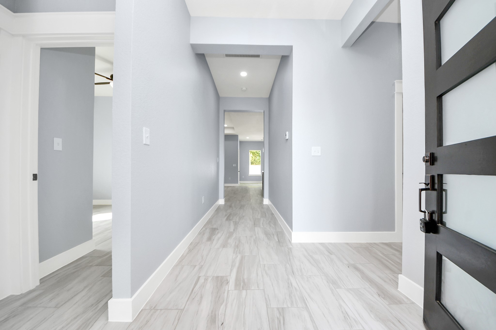 406 South Iowa Street La Porte, TX 77571 - Photo 8 of 49 a view of a hallway with wooden floor and a bathroom