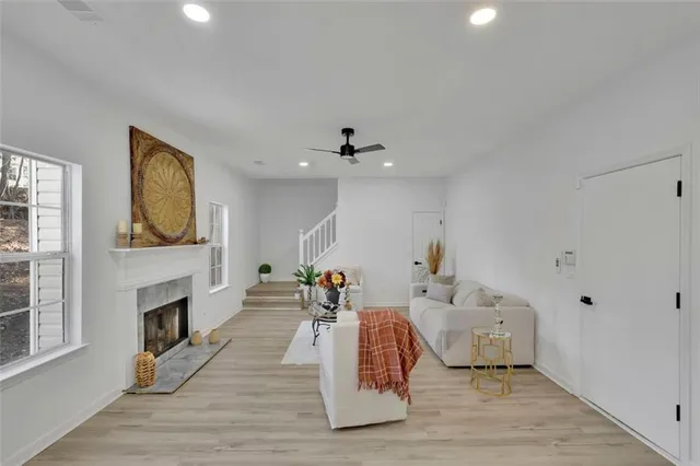 a living room with furniture fireplace and flat screen tv