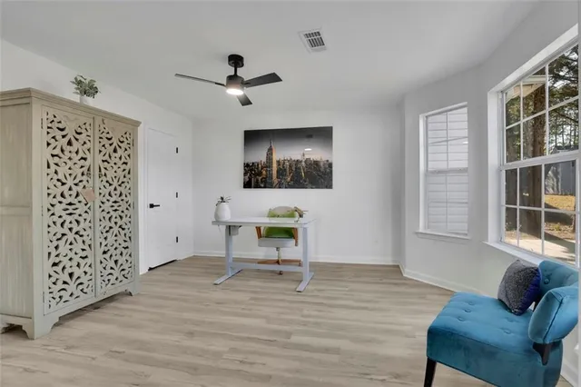 a view of a livingroom with furniture and windows