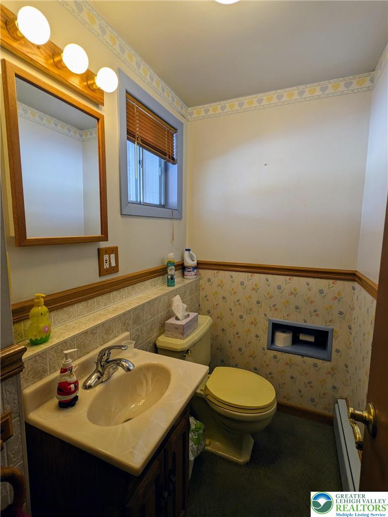 107 South 10th Street Coplay, PA 18037 - Photo 39 of 43 a bathroom with a toilet sink and mirror