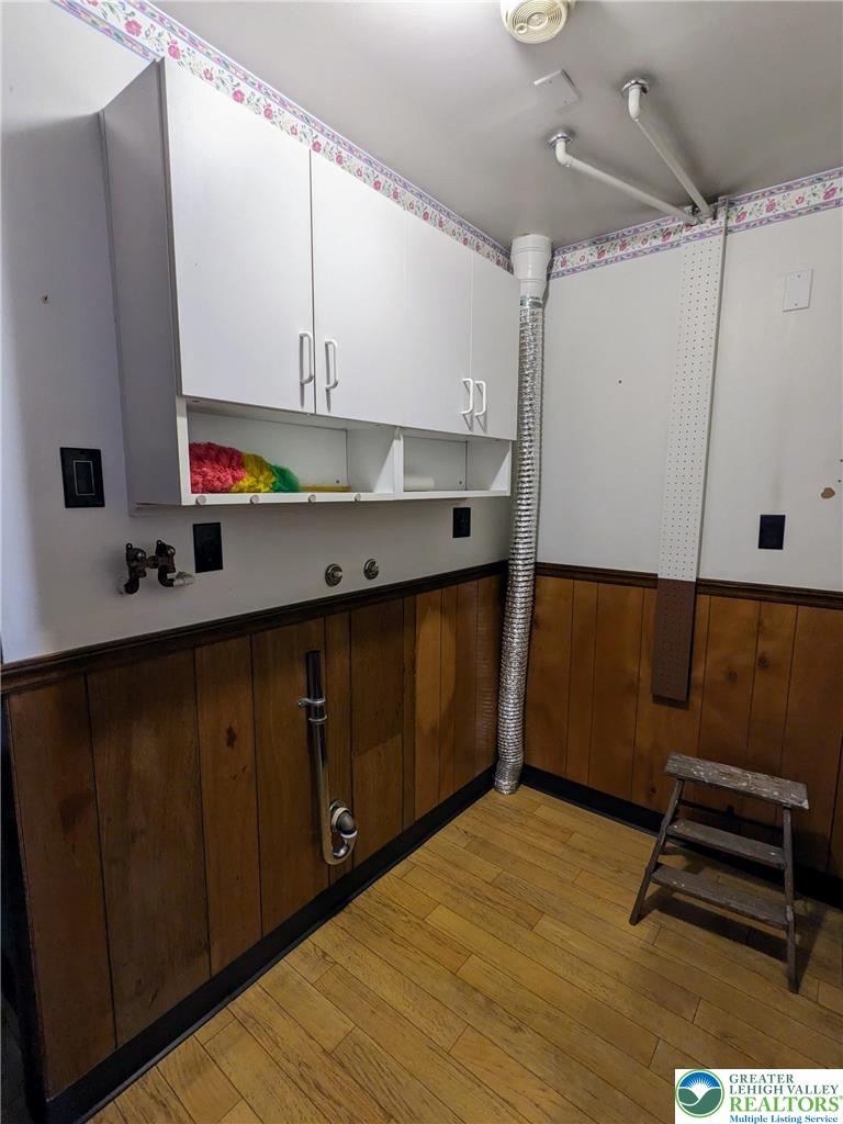 107 South 10th Street Coplay, PA 18037 - Photo 40 of 43 a kitchen with a wooden floor and a sink