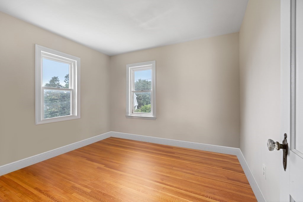 69 Fox Hill Road Nahant, MA 01908 - Photo 15 of 42 a view of empty room with wooden floor and fan