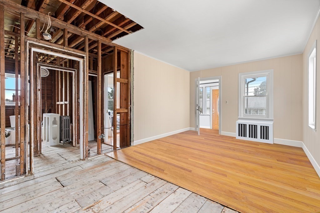 69 Fox Hill Road Nahant, MA 01908 - Photo 17 of 42 a bedroom with a bed and a walk in closet