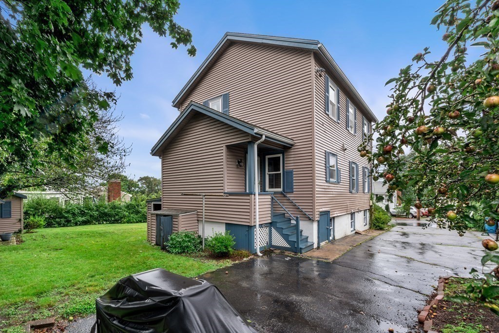 69 Fox Hill Road Nahant, MA 01908 - Photo 26 of 42 a front view of a house with a yard