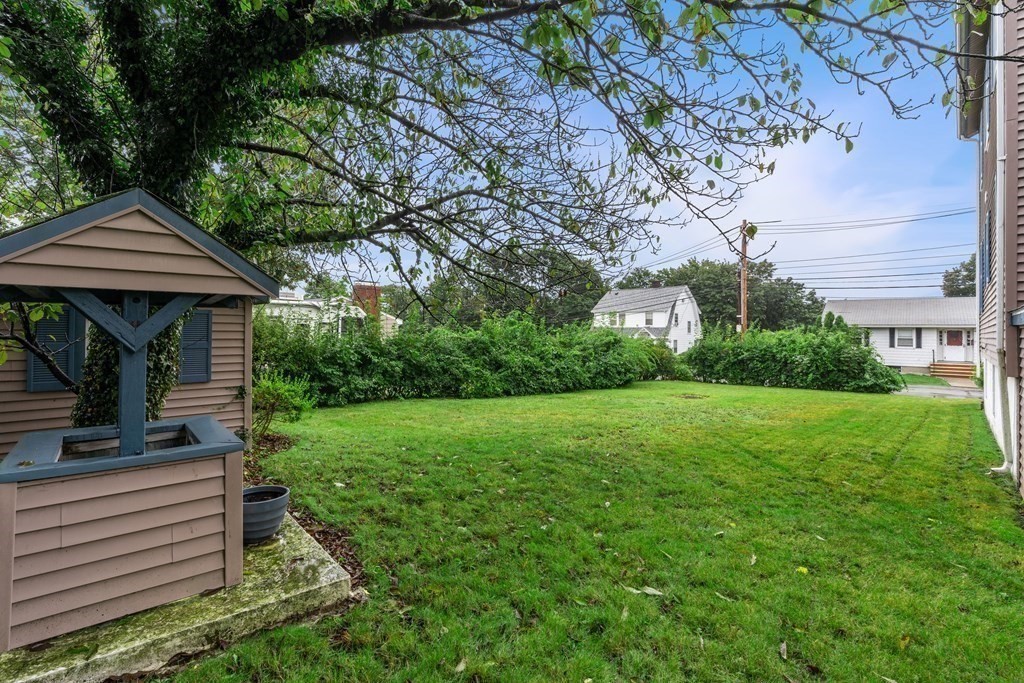 69 Fox Hill Road Nahant, MA 01908 - Photo 28 of 42 a front view of a house with garden