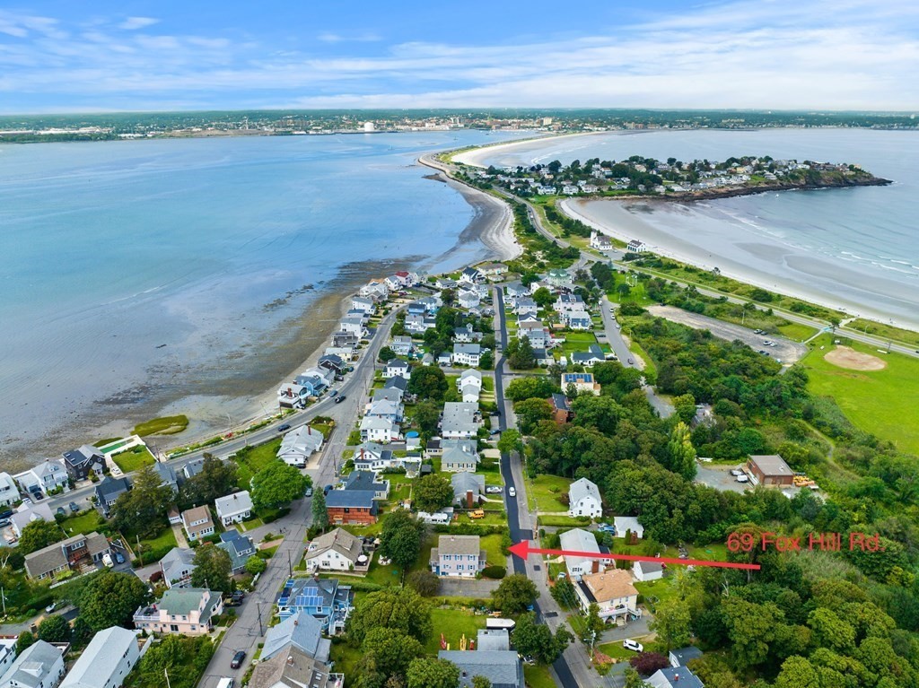 69 Fox Hill Road Nahant, MA 01908 - Photo 3 of 42 a view of a lake with a mountain in the background
