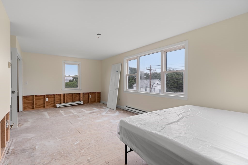 69 Fox Hill Road Nahant, MA 01908 - Photo 4 of 42 a bed sitting in a room next to a window