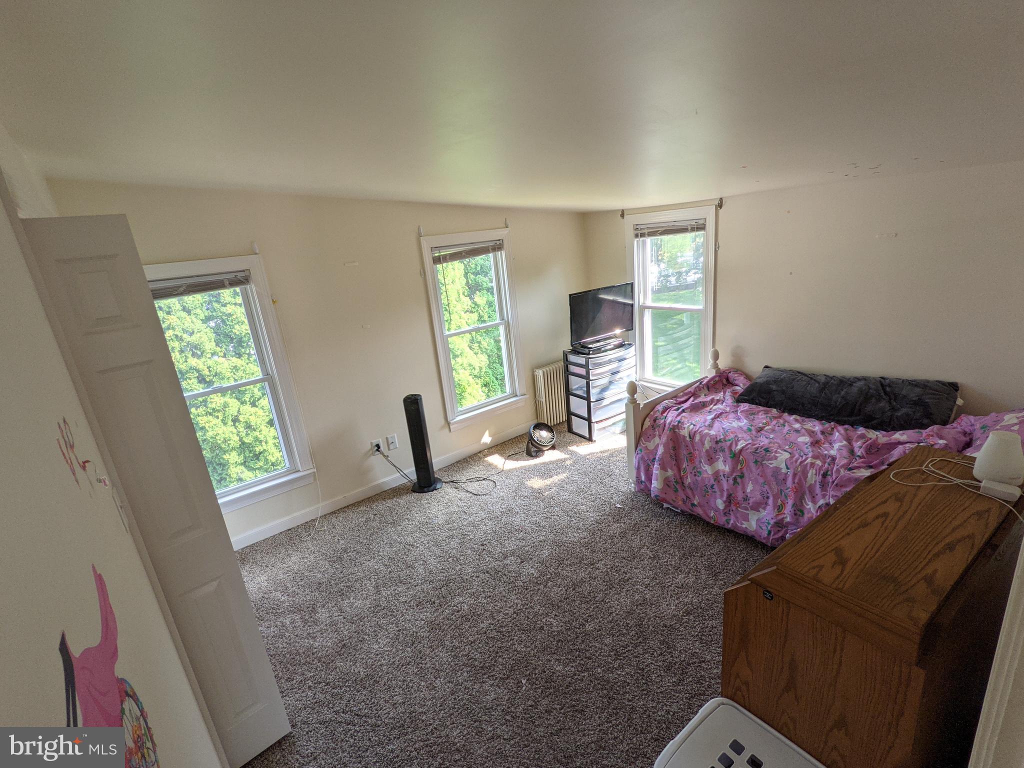 442 South Main Street, Unit A Manheim, PA 17545 - Photo 14 of 26 a bedroom with a bed and a window