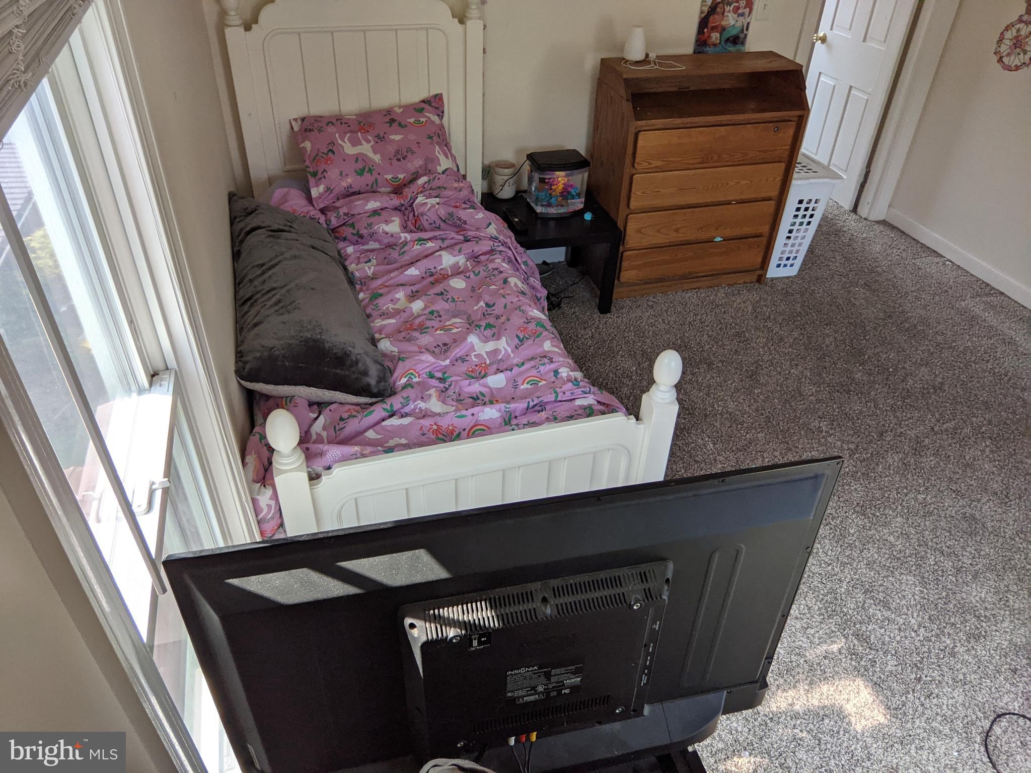 442 South Main Street, Unit A Manheim, PA 17545 - Photo 16 of 26 a bed sitting in a bedroom next to a window