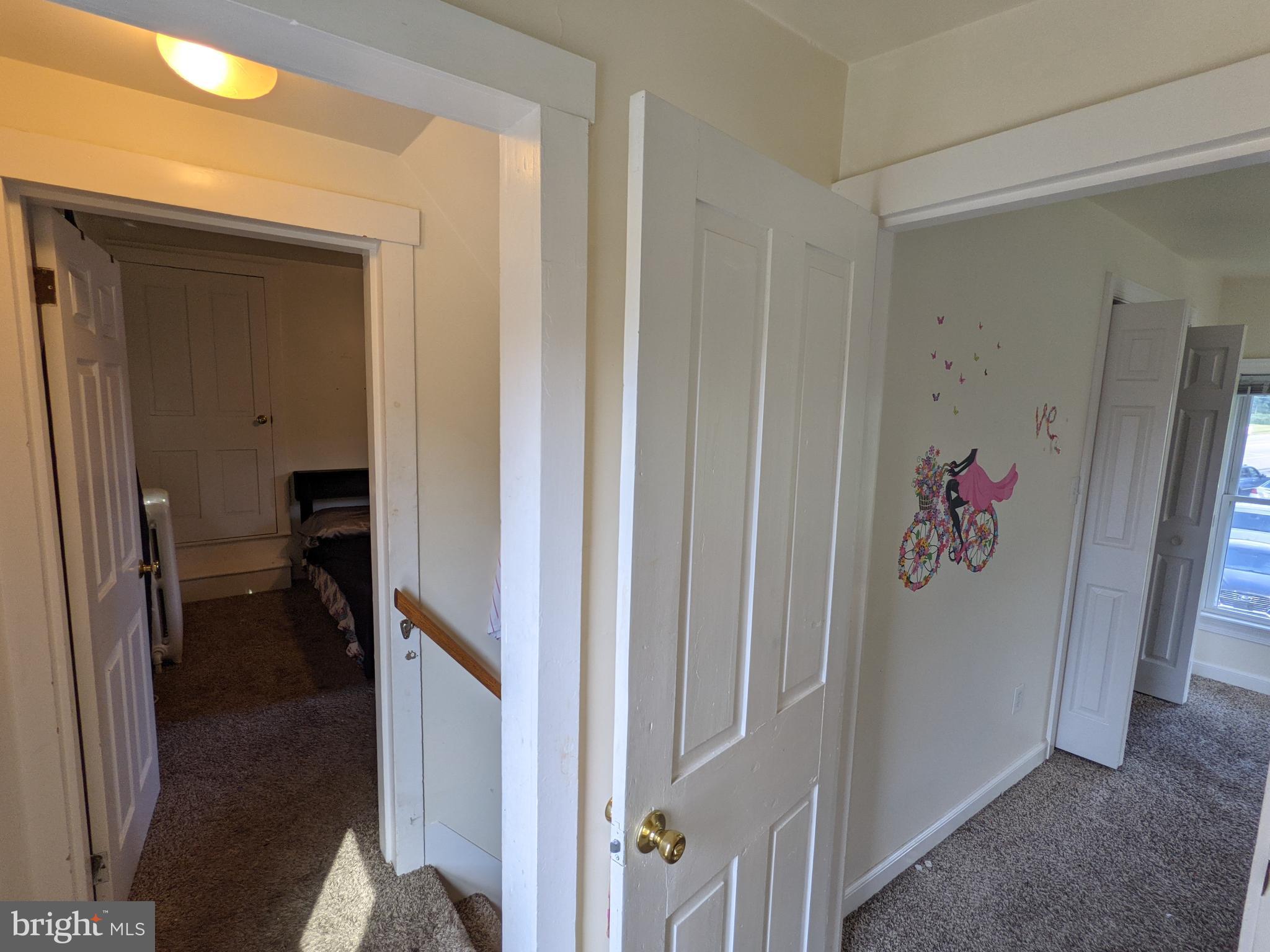 442 South Main Street, Unit A Manheim, PA 17545 - Photo 17 of 26 a hallway with kids room bathroom