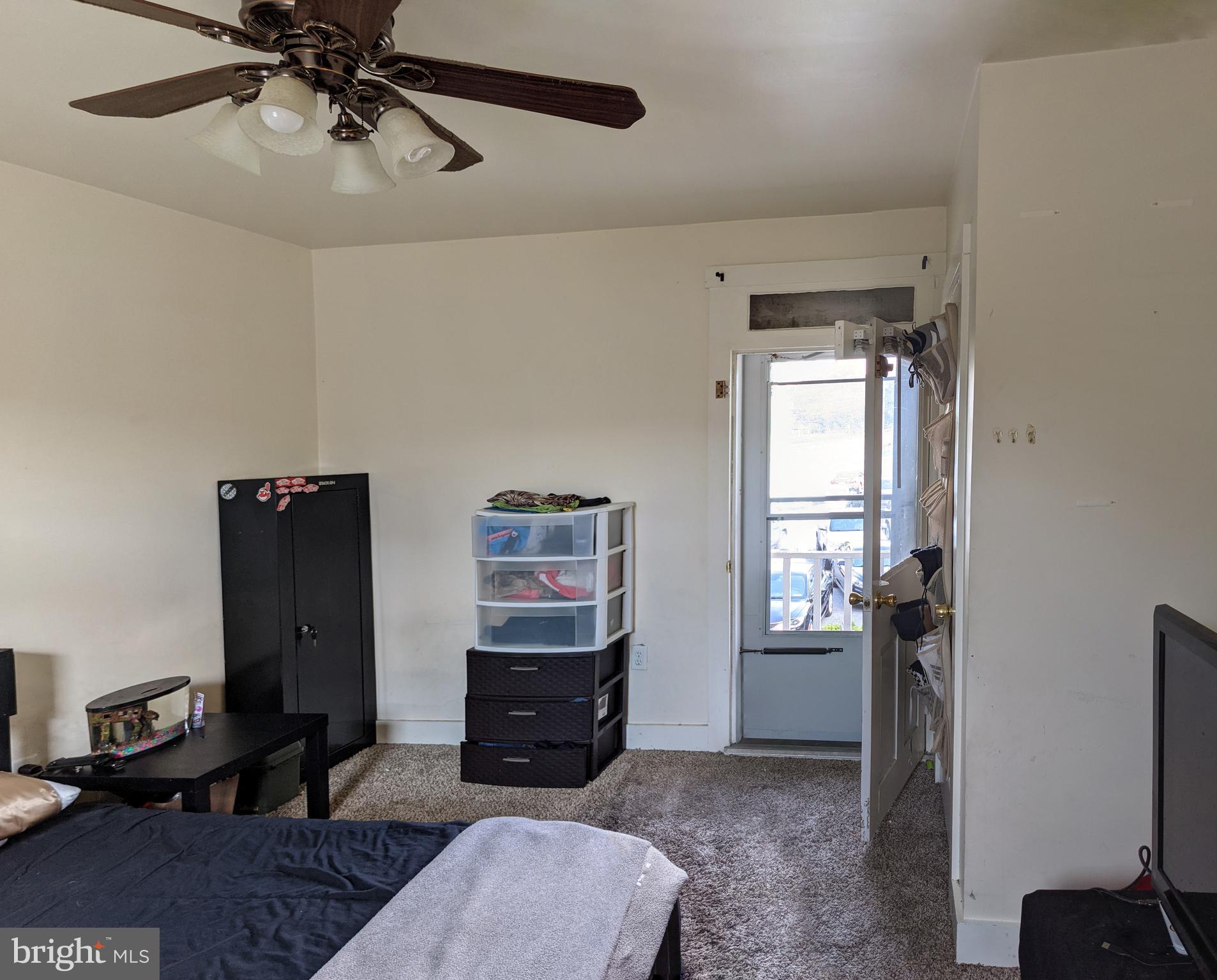 442 South Main Street, Unit A Manheim, PA 17545 - Photo 20 of 26 a living room with furniture a window and a flat screen tv