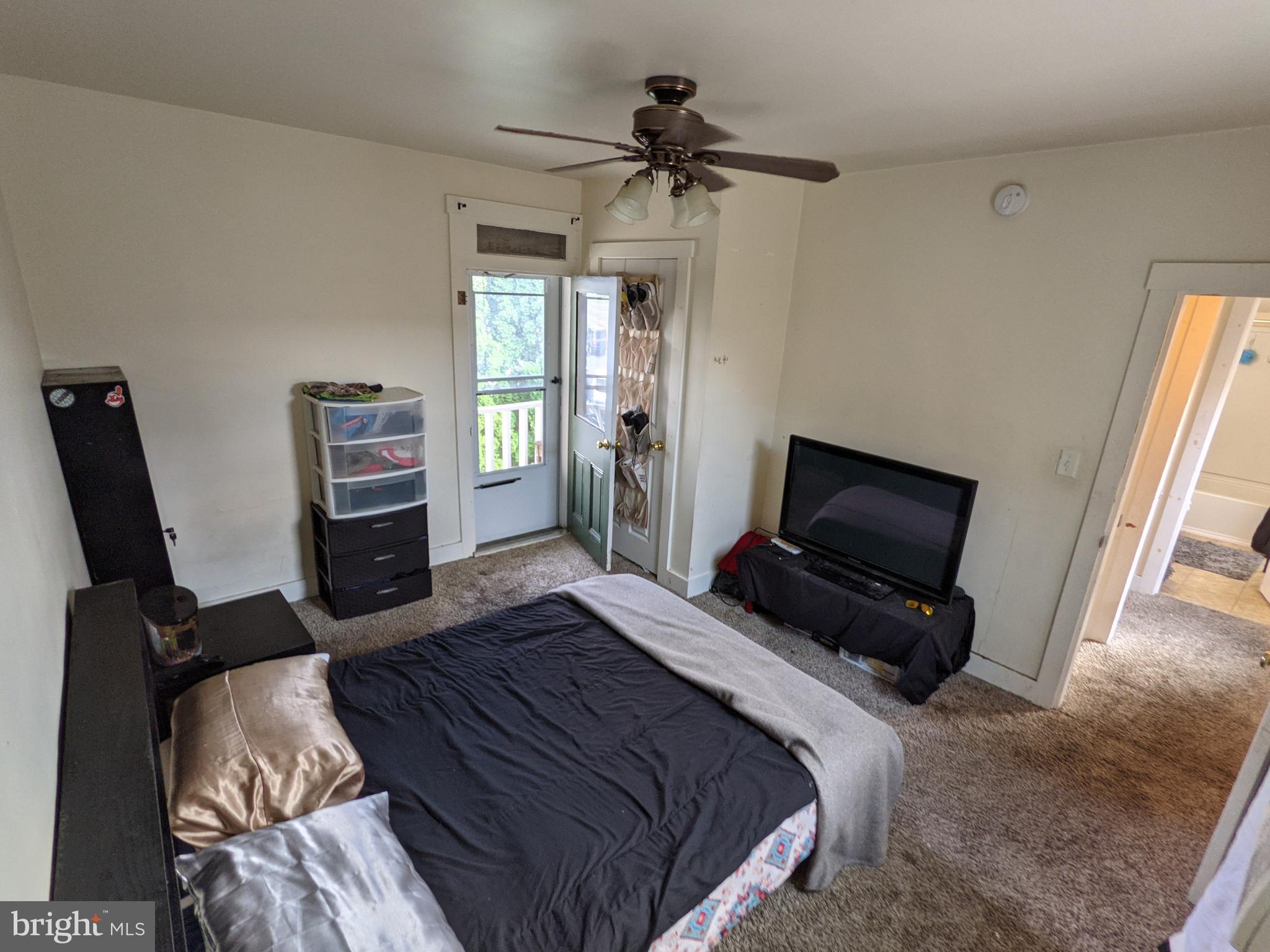 442 South Main Street, Unit A Manheim, PA 17545 - Photo 24 of 26 a bedroom with a bed and a television