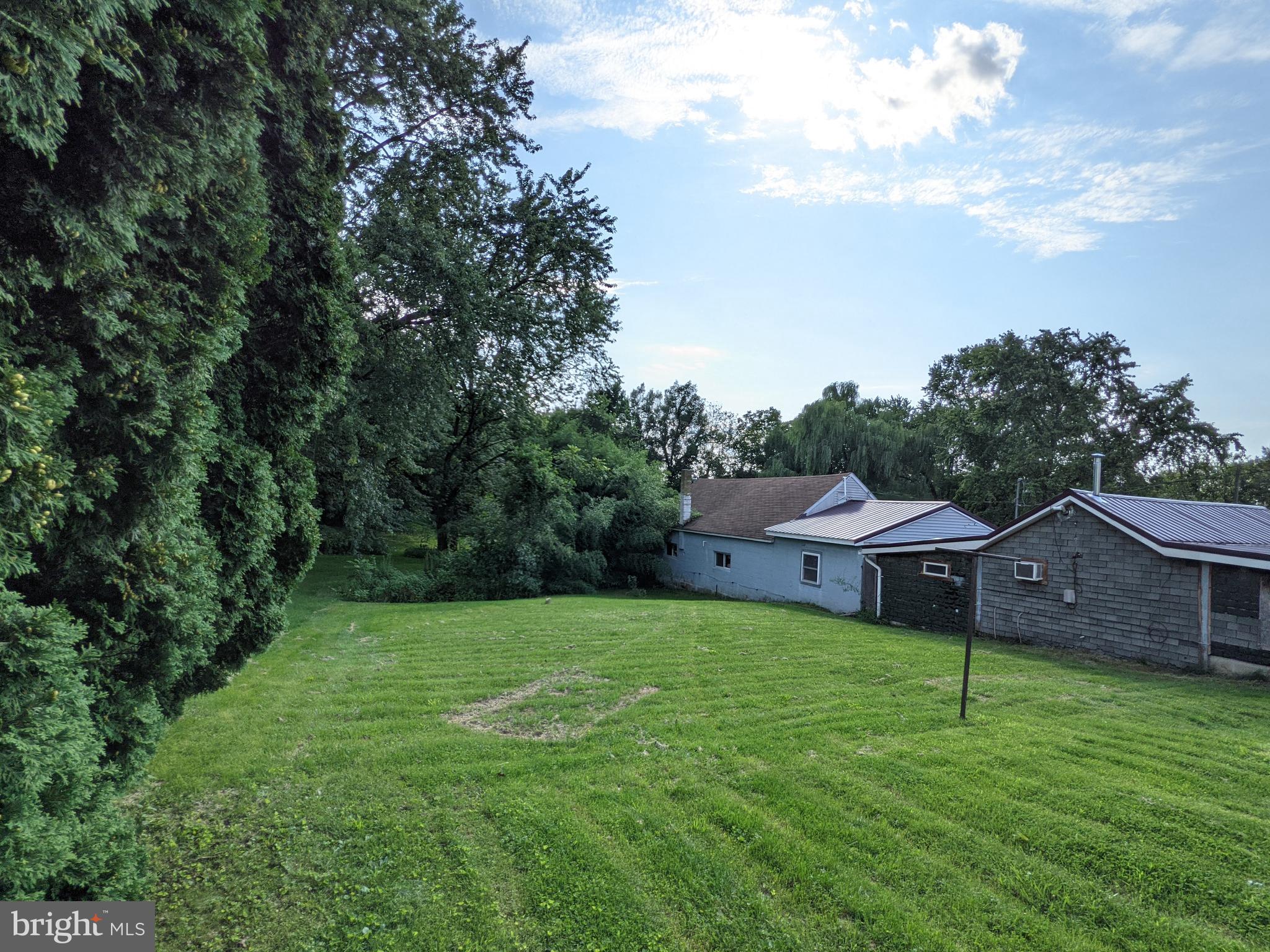442 South Main Street, Unit A Manheim, PA 17545 - Photo 26 of 26 a aerial view of a house with a yard and sitting area