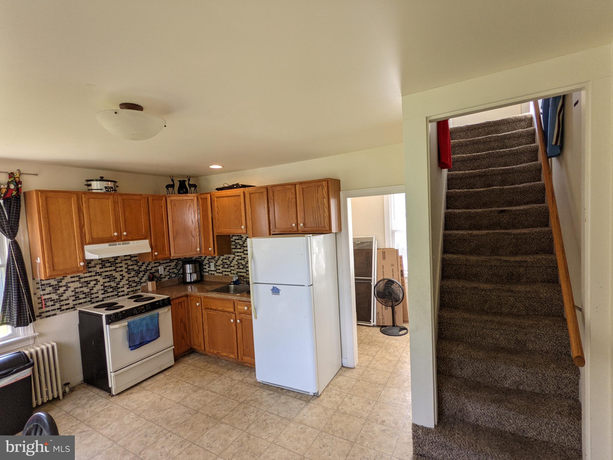 442 South Main Street, Unit A Manheim, PA 17545 - Photo 5 of 26 a kitchen with a refrigerator a stove and cabinets