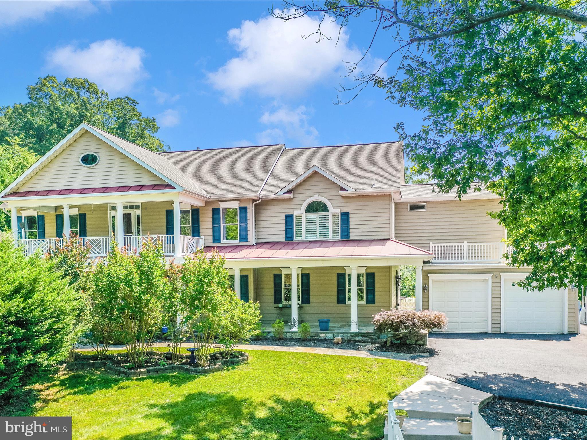 a front view of a house with swimming pool having outdoor seating