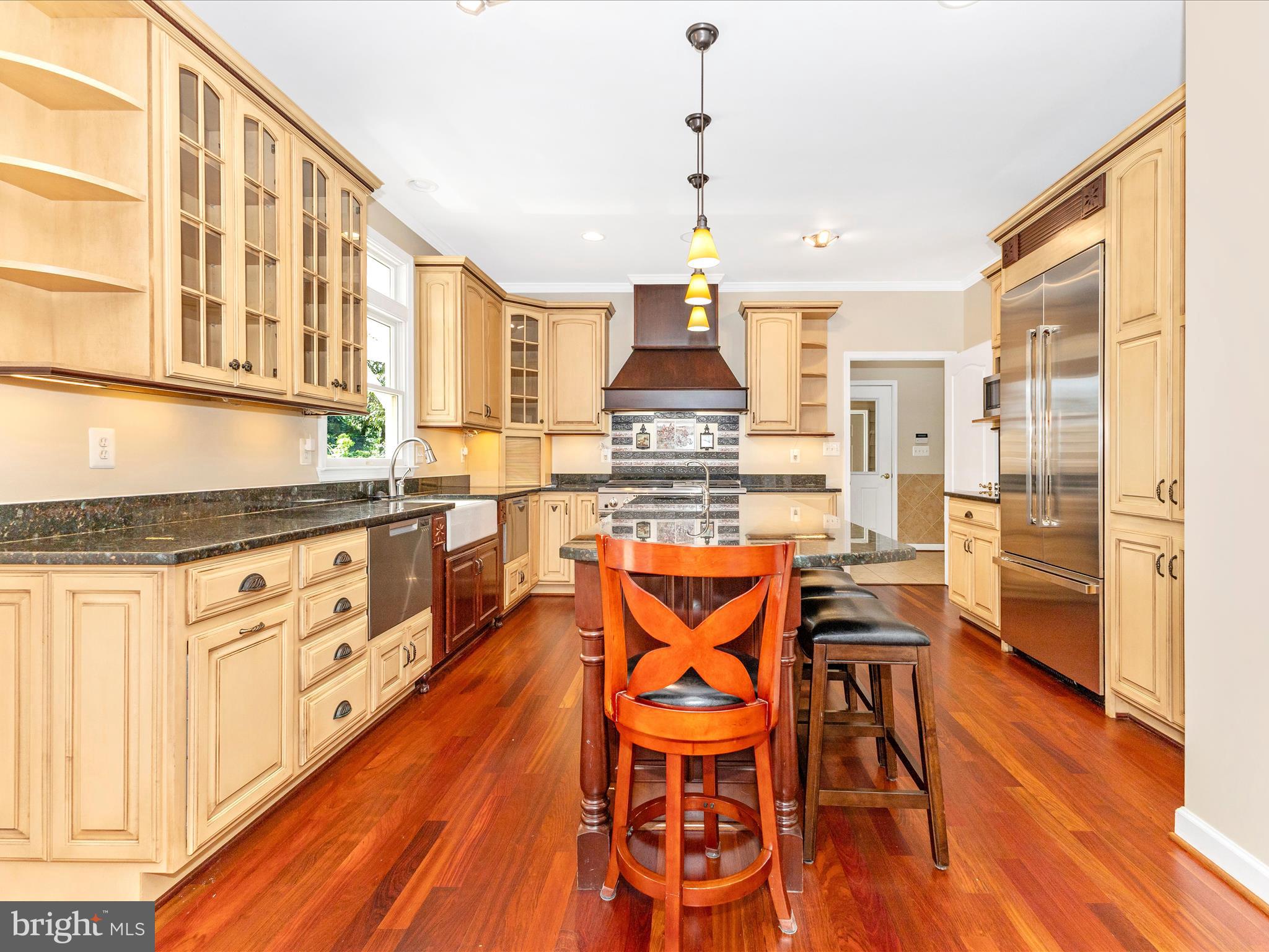 2305 Mt Ephraim Road Adamstown, MD 21710 - Photo 12 of 87 a kitchen with stainless steel appliances kitchen island wooden floors and white cabinets
