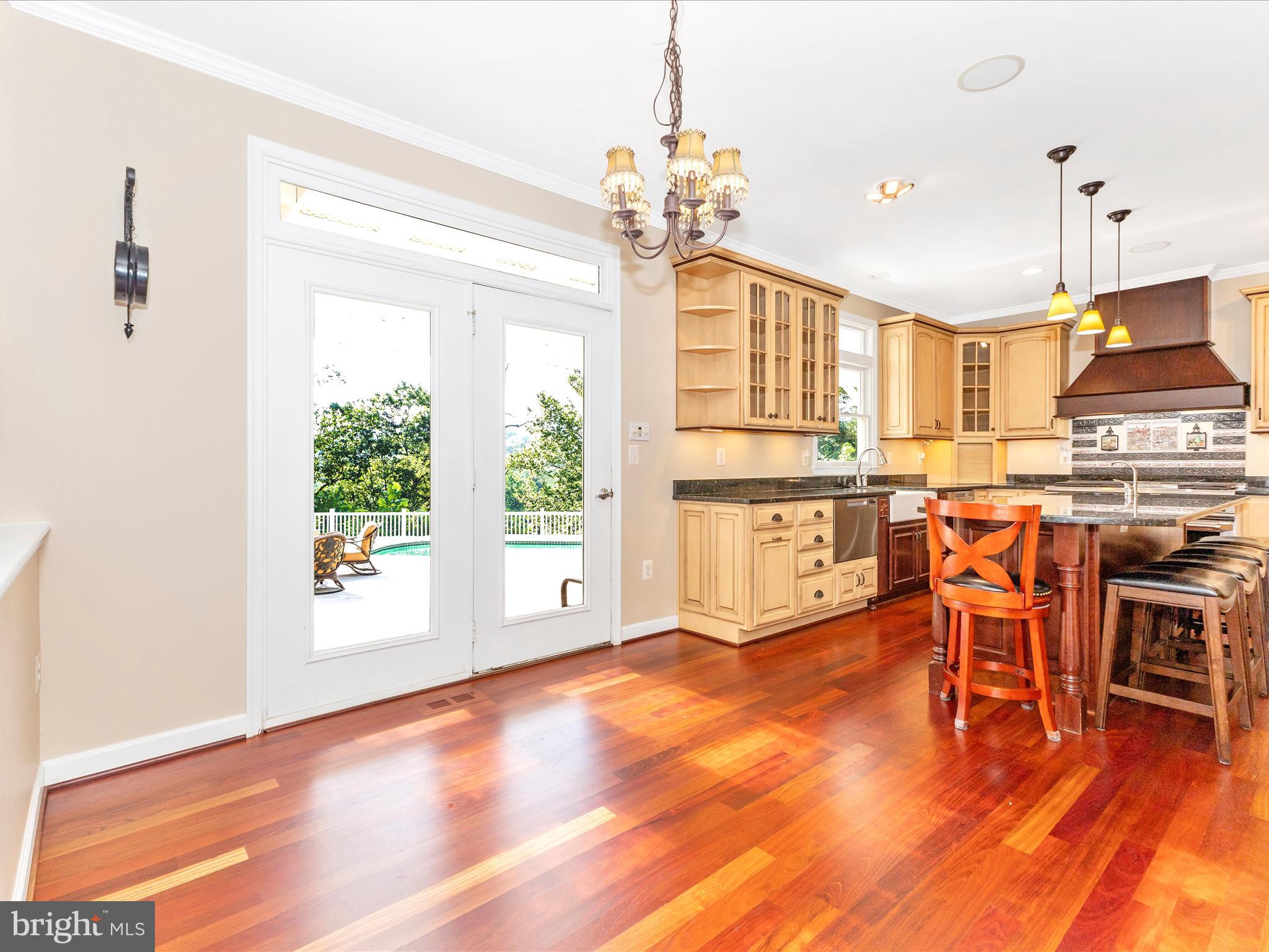 2305 Mt Ephraim Road Adamstown, MD 21710 - Photo 13 of 87 a dining room with furniture a chandelier and wooden floor