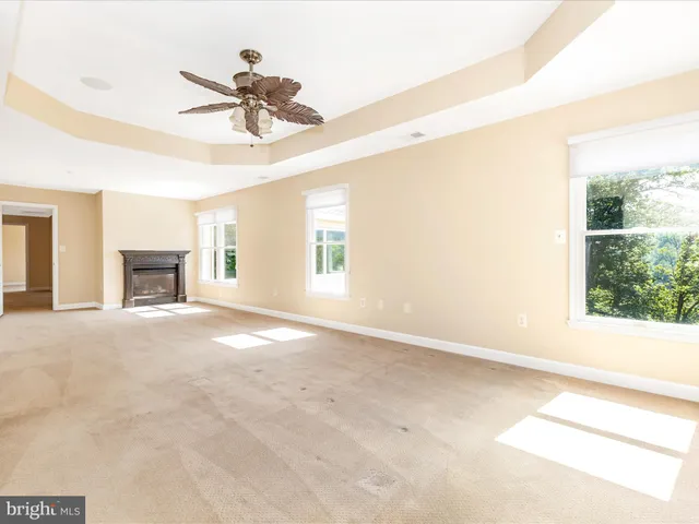 a white bath tub sitting next to a white toilet