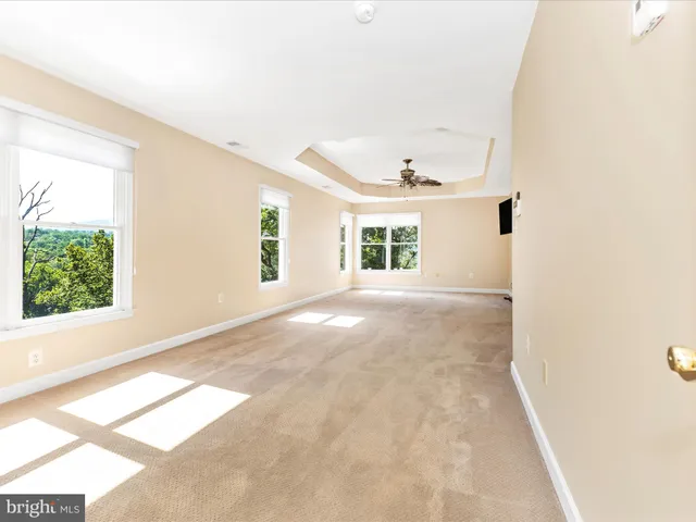 a view of a house with swimming pool and sitting area