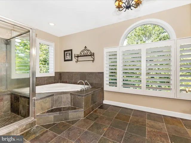 a view of a swimming pool with outdoor seating