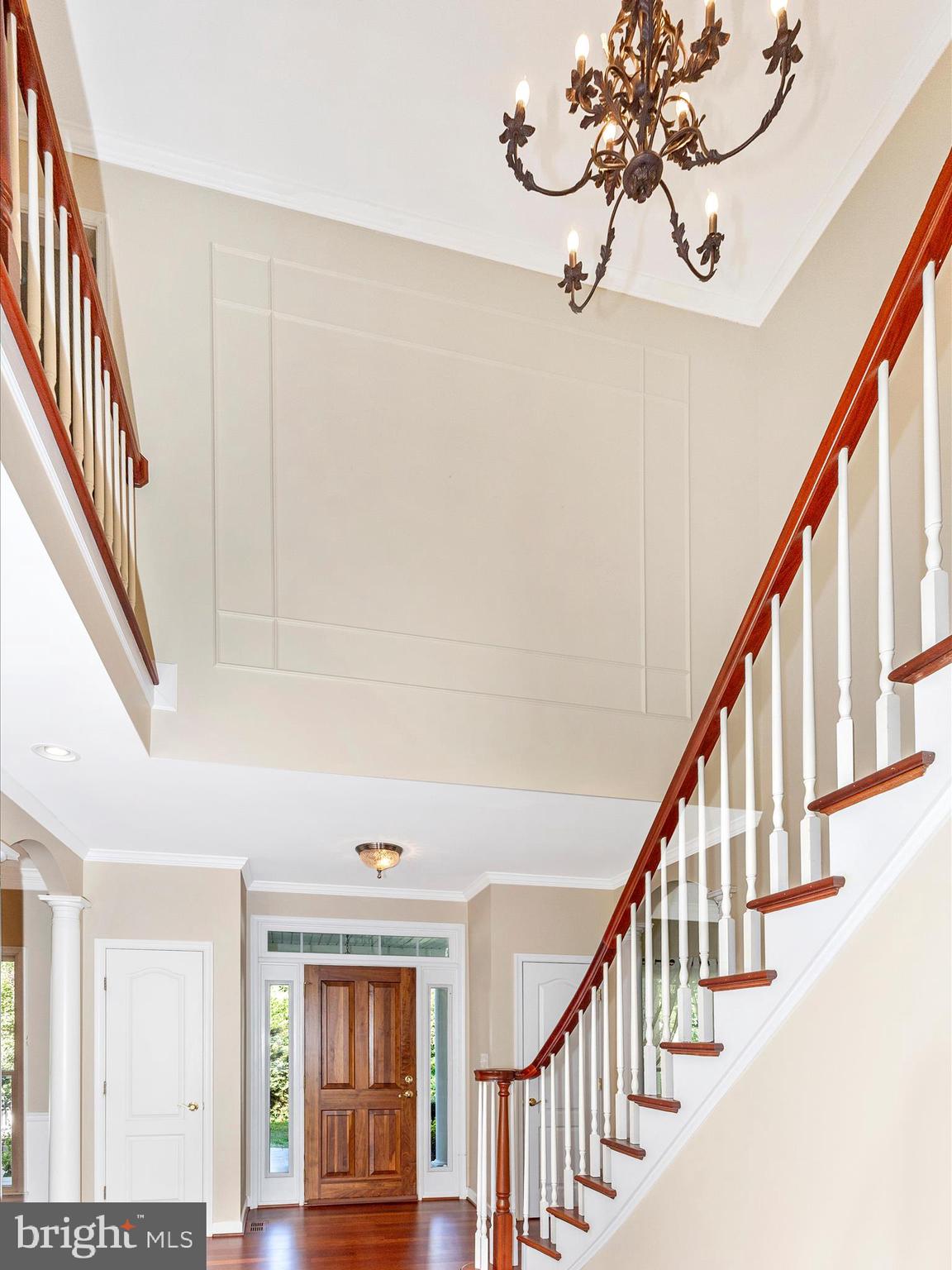 2305 Mt Ephraim Road Adamstown, MD 21710 - Photo 4 of 87 a view of staircase with wooden floor and chandelier