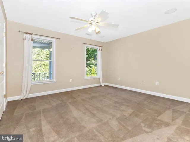 a view of a porch with wooden floor and outdoor space