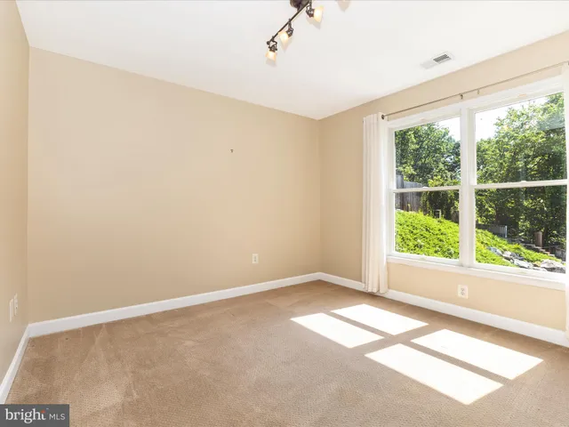 a view of a balcony with wooden floor