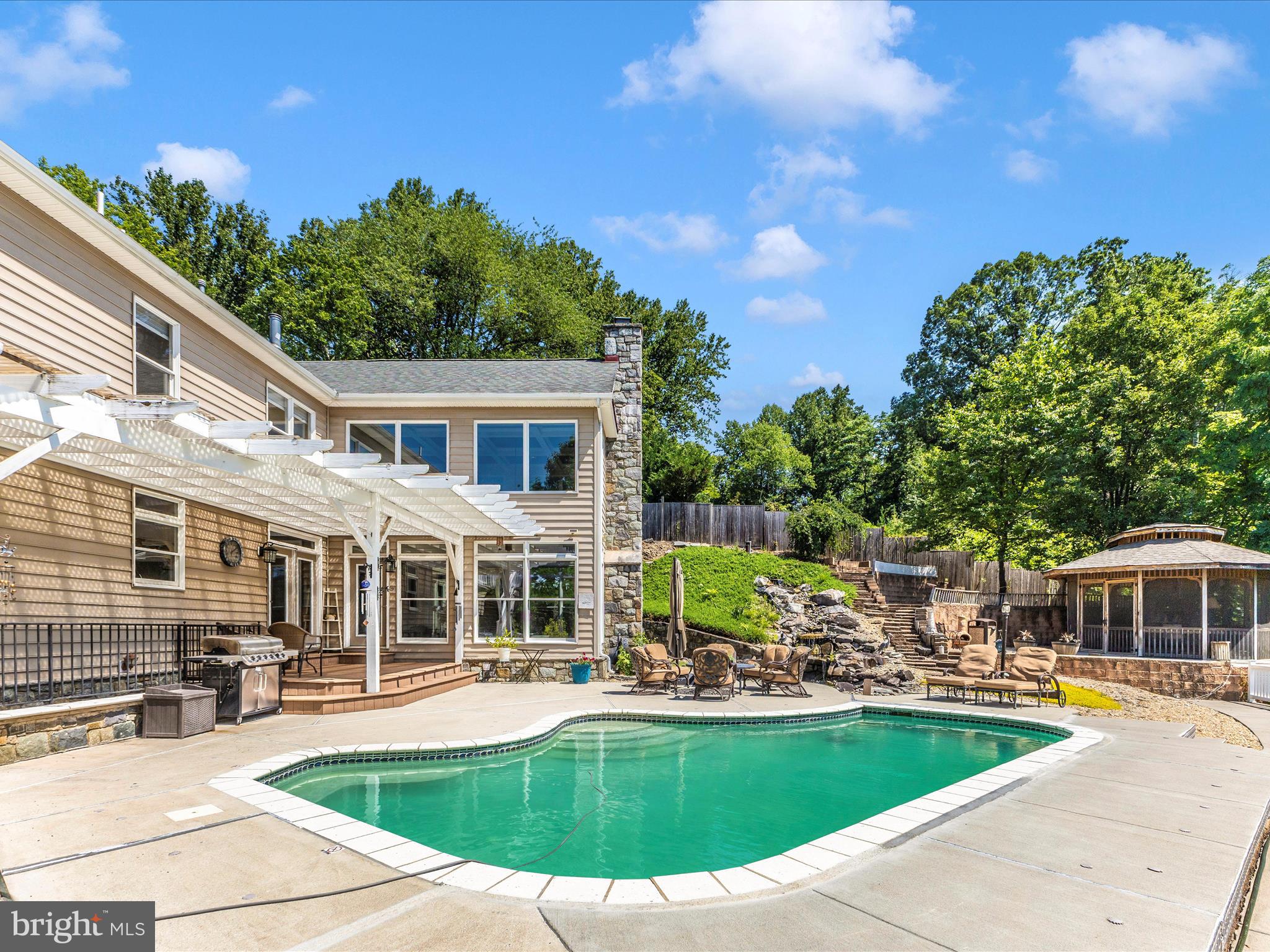 2305 Mt Ephraim Road Adamstown, MD 21710 - Photo 52 of 87 a view of a house with swimming pool and sitting area