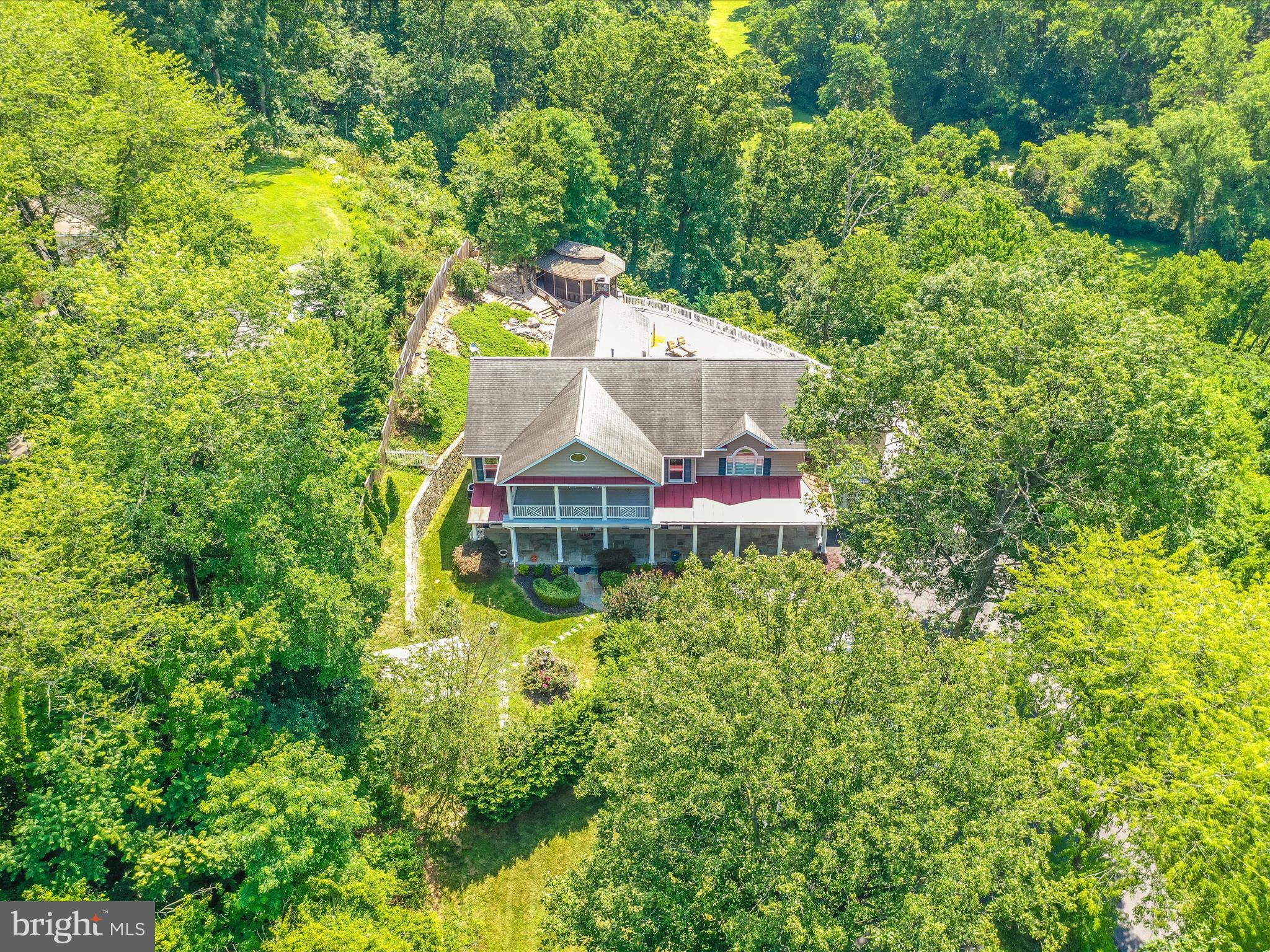 2305 Mt Ephraim Road Adamstown, MD 21710 - Photo 71 of 87 an aerial view of a house with swimming pool and garden