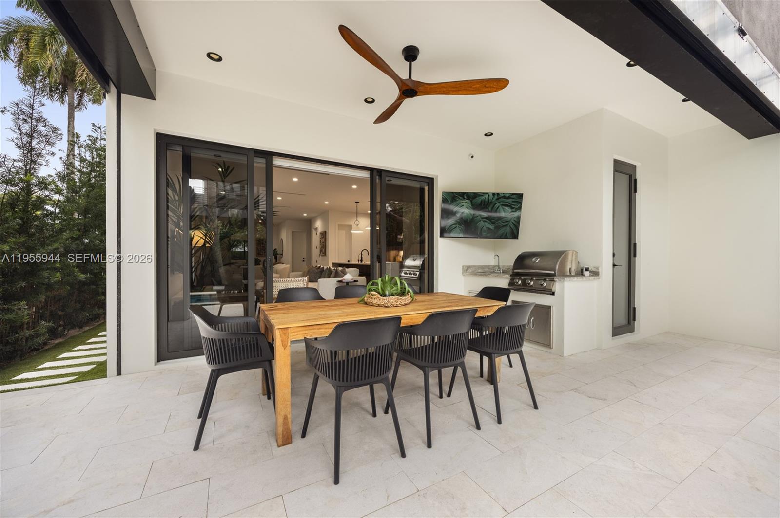 3151 Hibiscus Street, Unit 3151 Miami, FL 33133 - Photo 30 of 47 a dining room with furniture and a large window