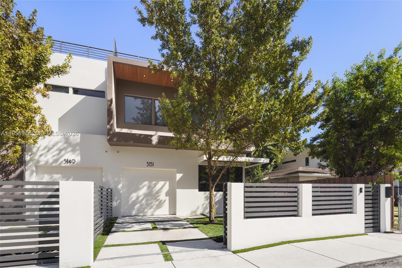 3151 Hibiscus Street, Unit 3151 Miami, FL 33133 - Photo 34 of 47 a front view of a house with a tree
