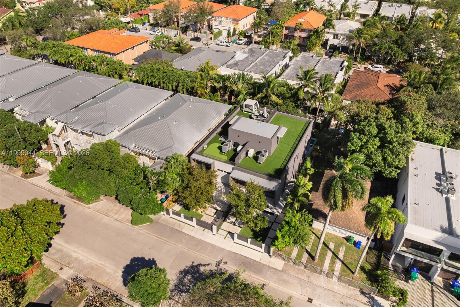3151 Hibiscus Street, Unit 3151 Miami, FL 33133 - Photo 40 of 47 an aerial view of a house with a yard and trees