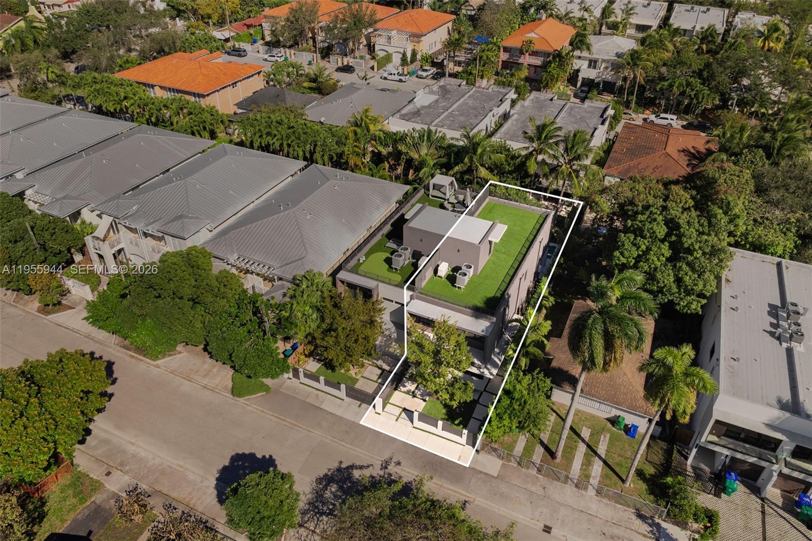 3151 Hibiscus Street, Unit 3151 Miami, FL 33133 - Photo 41 of 47 an aerial view of a house with a yard and street