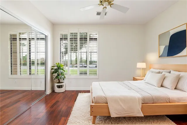 a bedroom with a large bed and a window