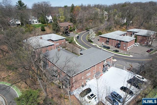 20-30 Ridge Road, Unit A5 Ridgewood, NJ 07450 - Photo 22 of 26 a view of a house with pool and chairs