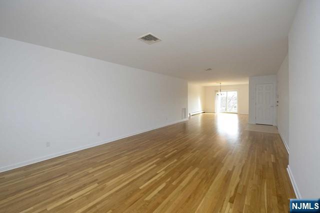 20-30 Ridge Road, Unit A5 Ridgewood, NJ 07450 - Photo 7 of 26 a view of empty room with wooden floor and fan