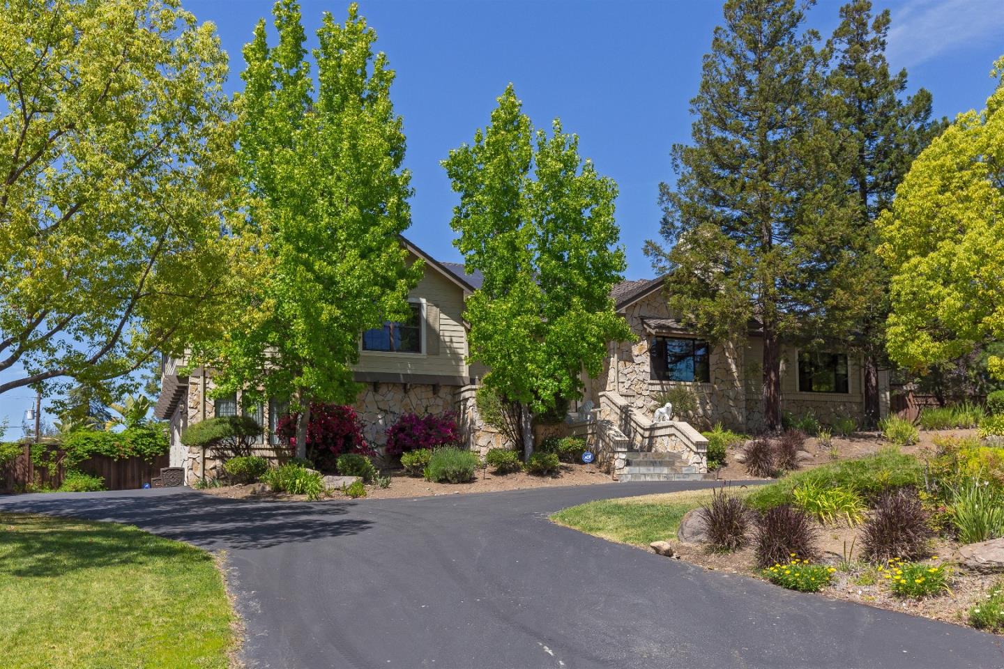 105 Alerche Drive Los Gatos, CA 95032 - Photo 16 of 36 a front view of a house with a yard and swimming pool