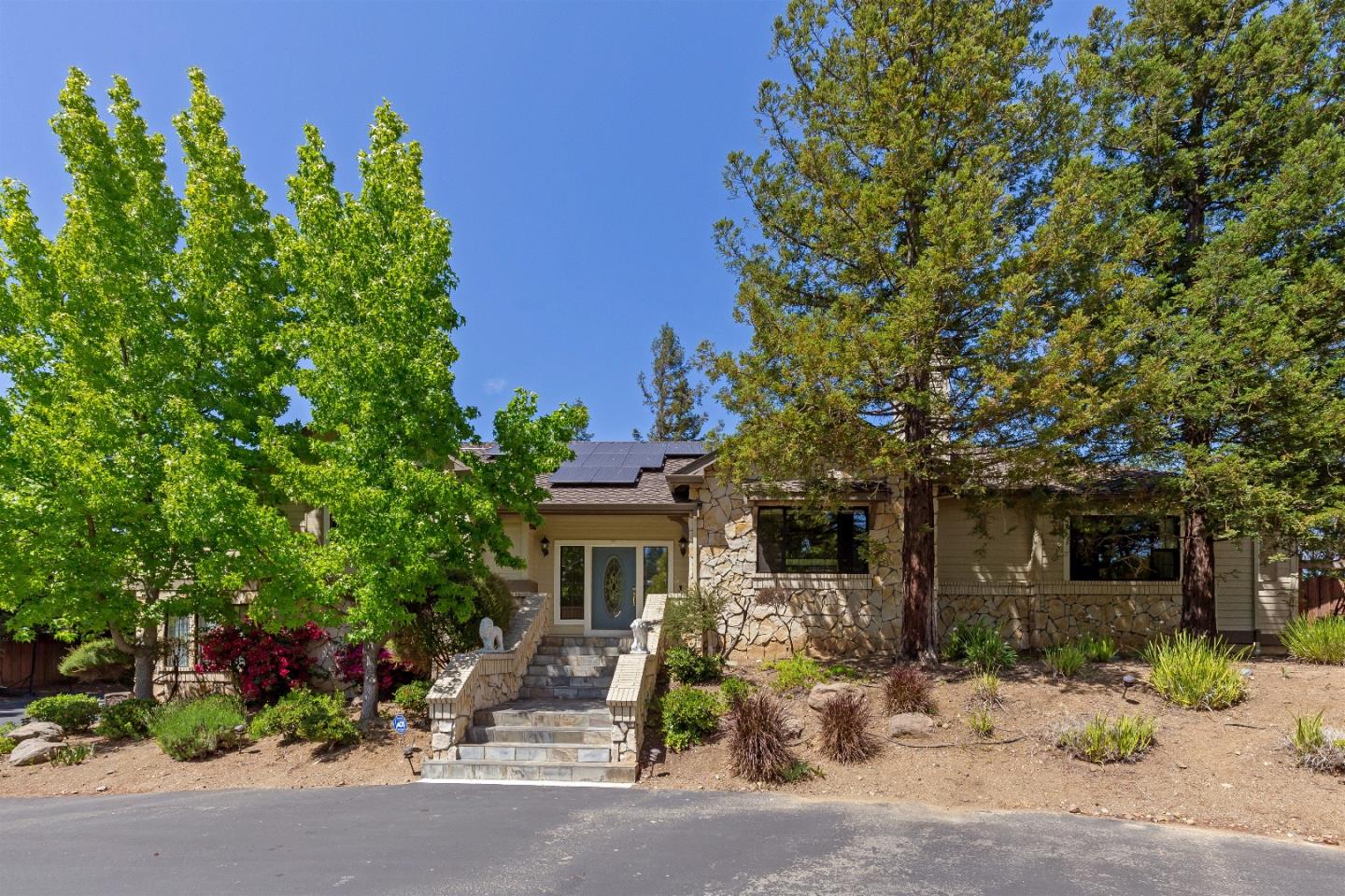 105 Alerche Drive Los Gatos, CA 95032 - Photo 17 of 36 a front view of a house with garden