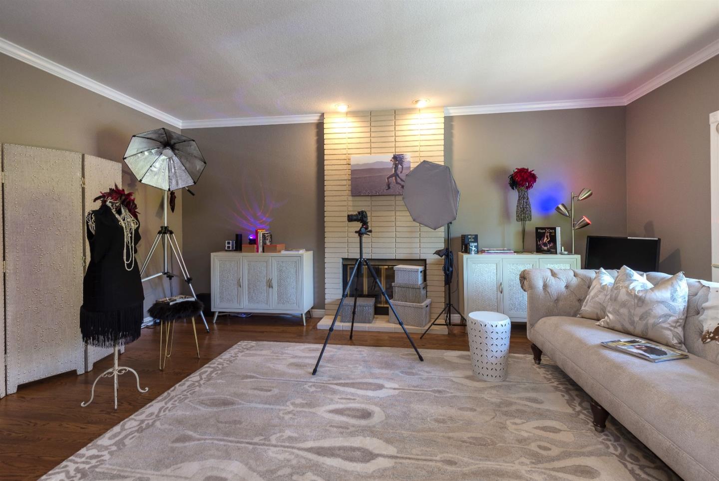 105 Alerche Drive Los Gatos, CA 95032 - Photo 19 of 36 a living room with furniture and a gym machine