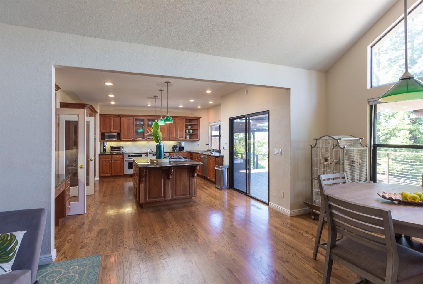 105 Alerche Drive Los Gatos, CA 95032 - Photo 21 of 36 a living room with stainless steel appliances kitchen island granite countertop furniture and a wooden floor