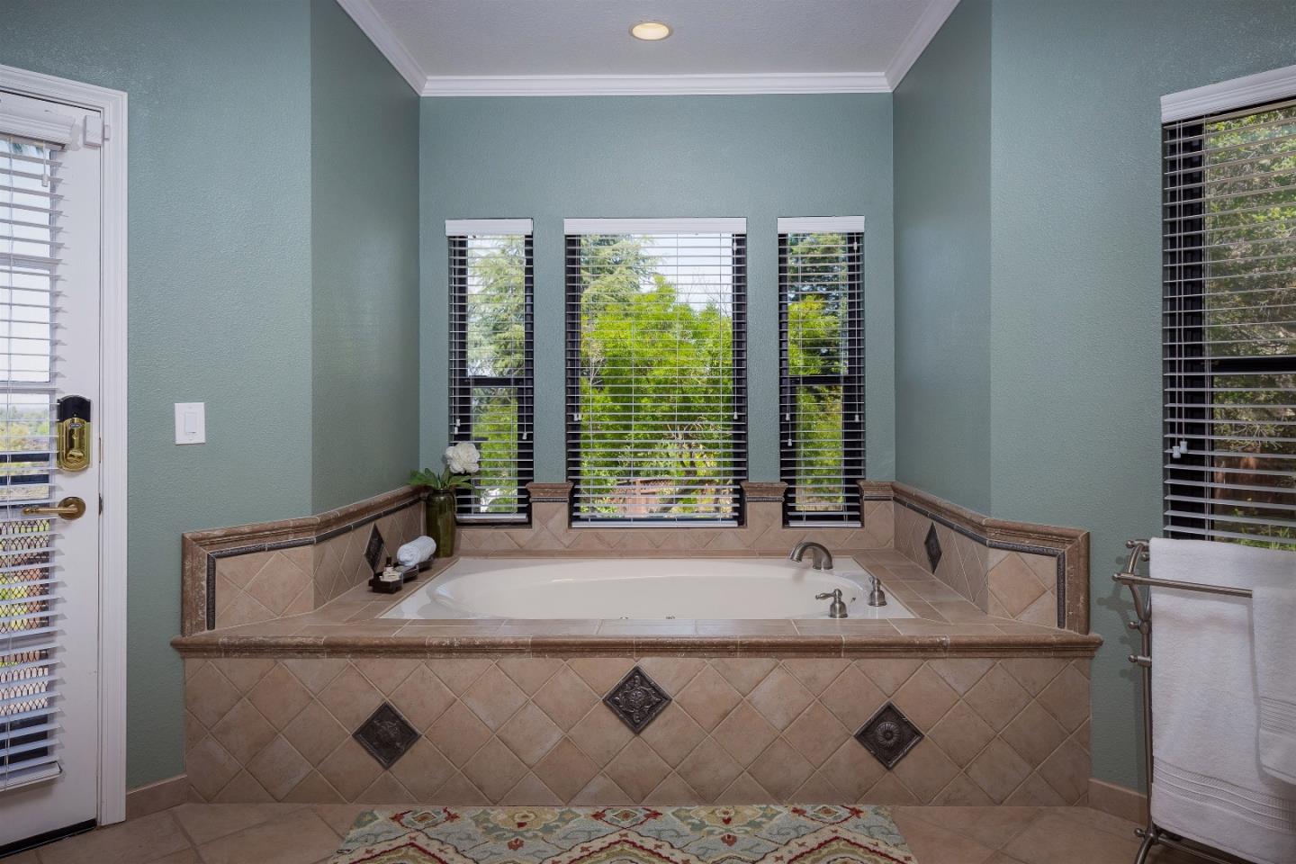 105 Alerche Drive Los Gatos, CA 95032 - Photo 24 of 36 a bathroom with a tub and a sink