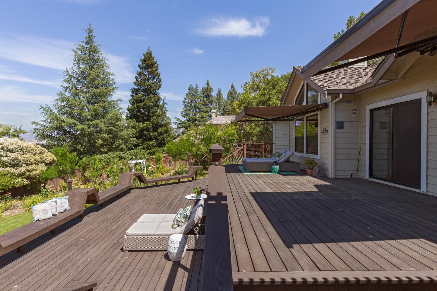 105 Alerche Drive Los Gatos, CA 95032 - Photo 35 of 36 a view of a patio with couches table and chairs with wooden floor and fence
