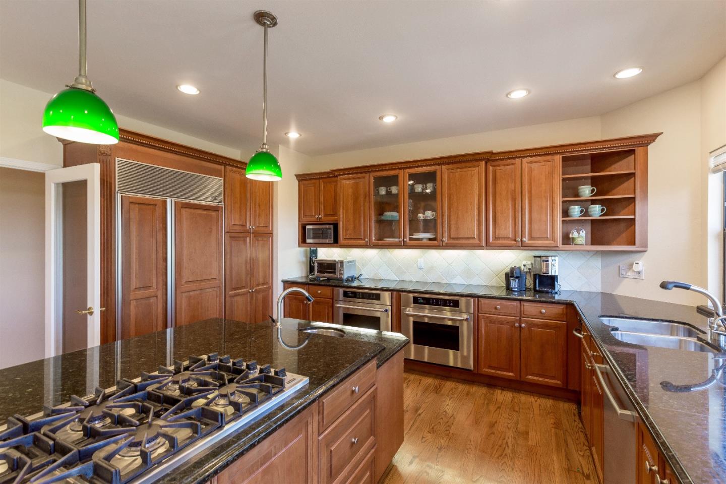 105 Alerche Drive Los Gatos, CA 95032 - Photo 5 of 36 a kitchen that has a lot of cabinets in it