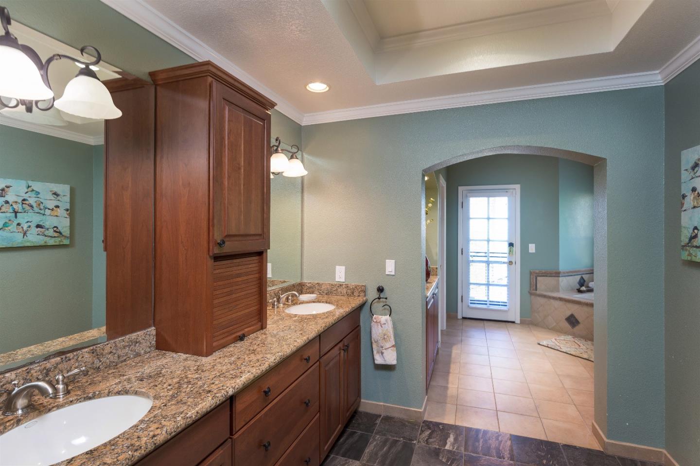 105 Alerche Drive Los Gatos, CA 95032 - Photo 8 of 36 a bathroom with a granite countertop sink and a mirror