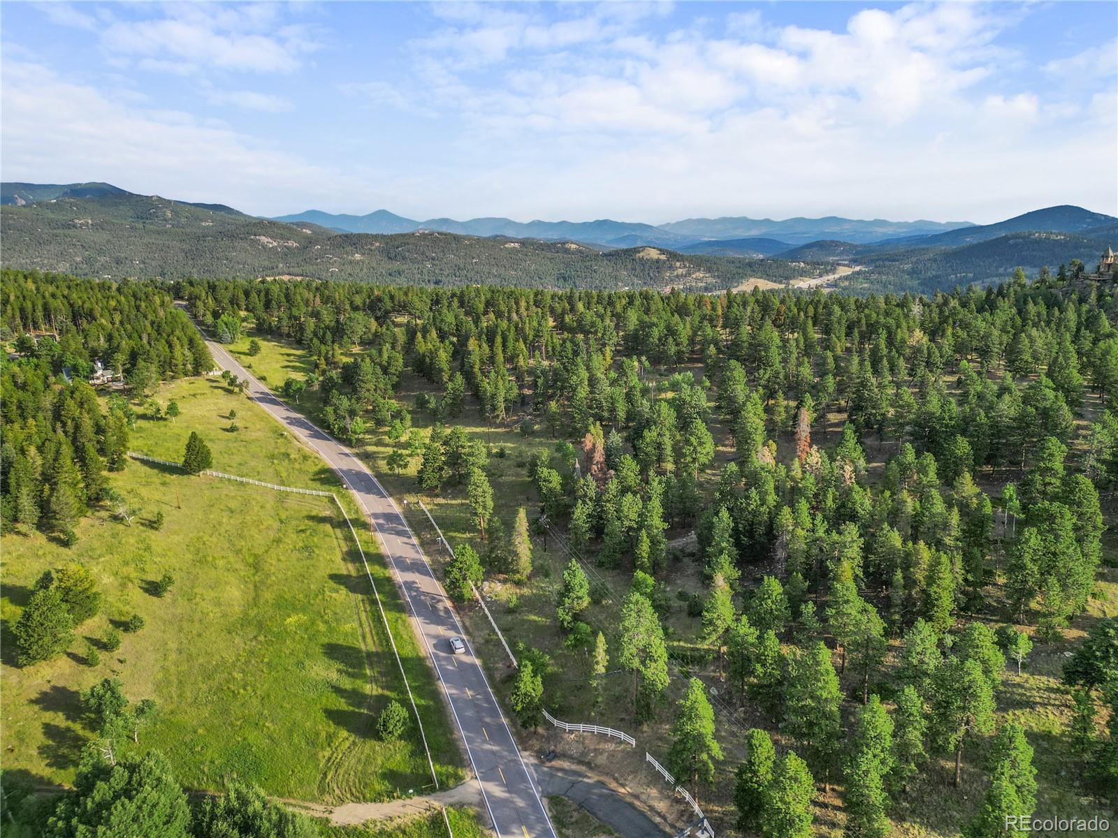 26541 Richmond Hill Road Conifer, CO 80433 - Photo 23 of 27 a view of lake with mountain