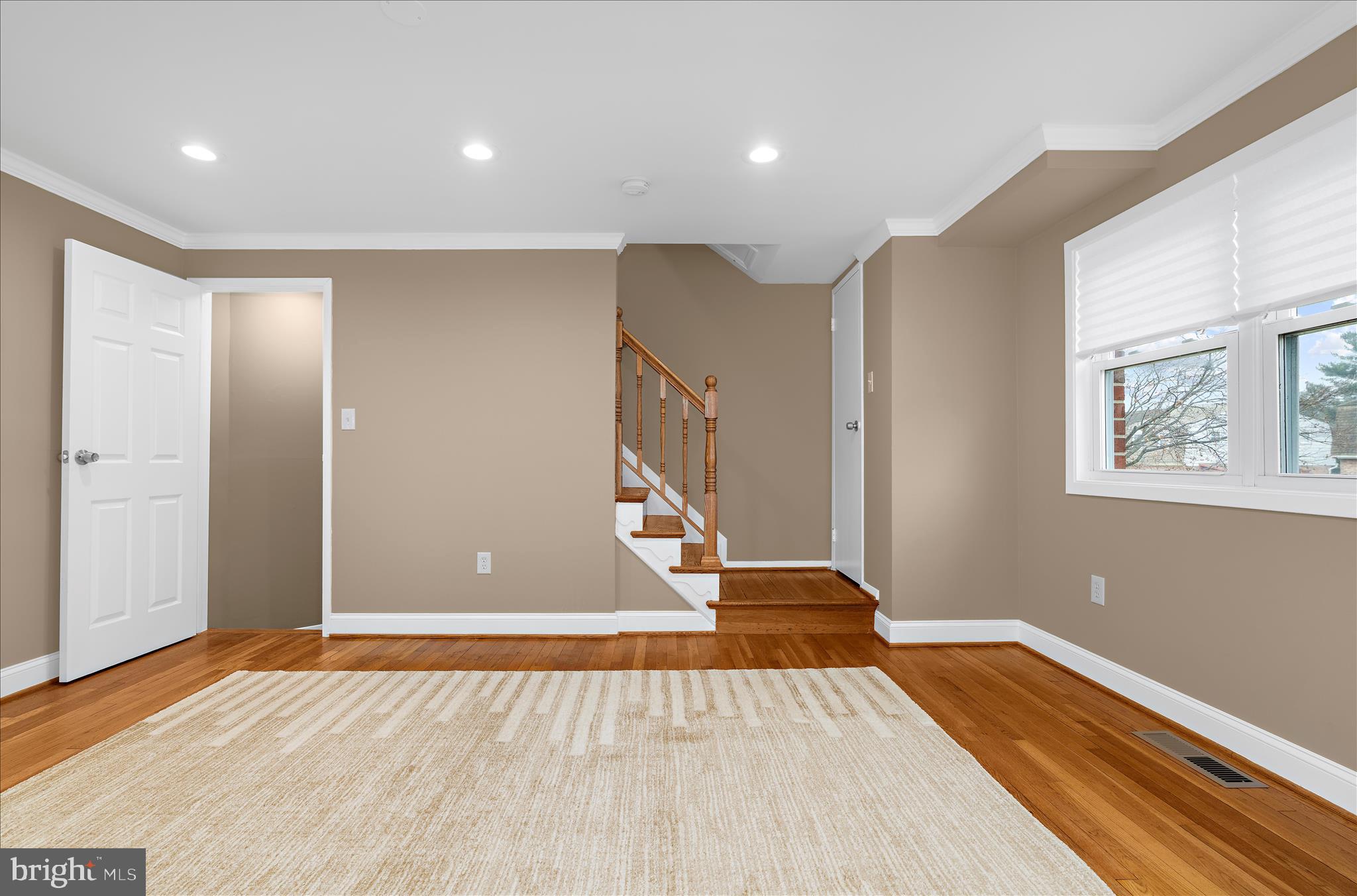 725 Kingston Road Baltimore, MD 21220 - Photo 7 of 55 a view of an empty room with wooden floor