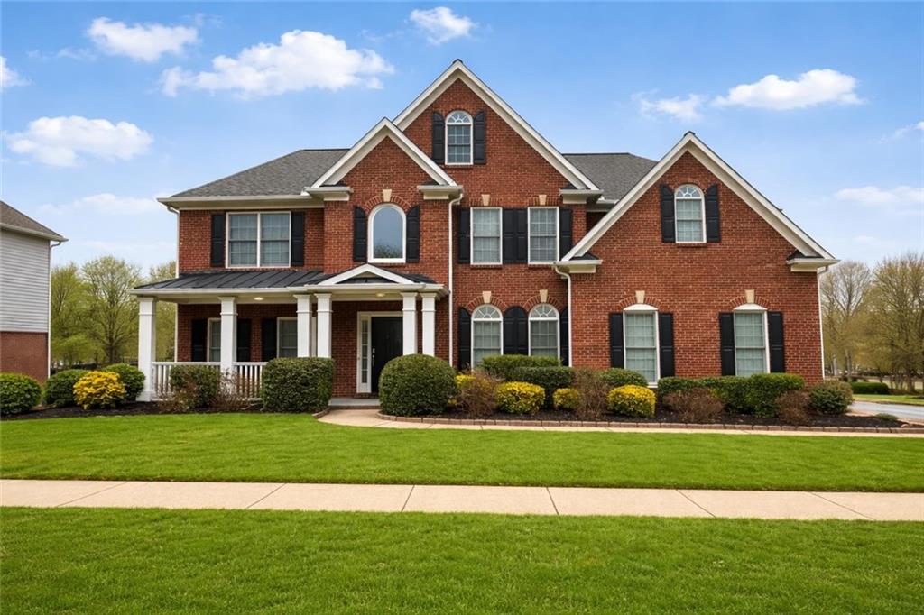 915 Bishops Crossing Norcross, GA 30071 - Photo 1 of 10 a front view of a house with a yard