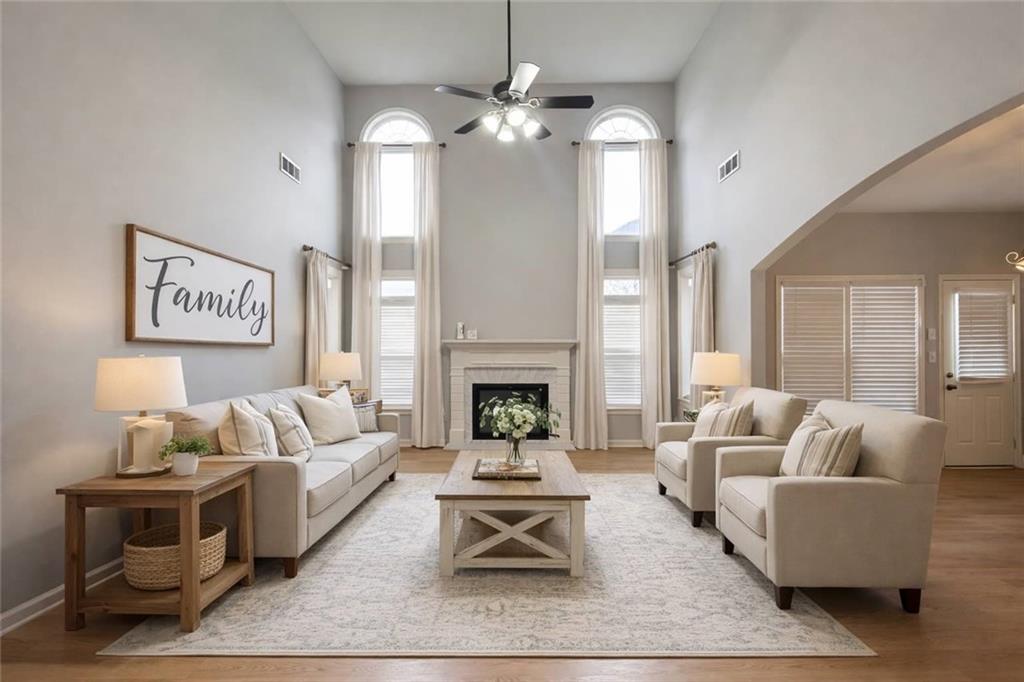 915 Bishops Crossing Norcross, GA 30071 - Photo 2 of 10 a living room with furniture and a fireplace