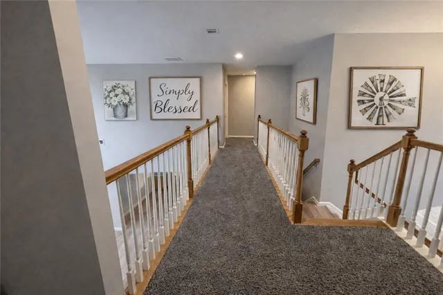 a view of a hallway with windows